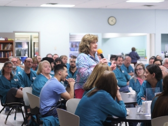 Founder Gerardine Ferlins addressing the company