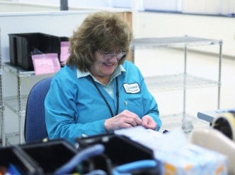 Founder Gerardine Ferlins working in the press and preform area